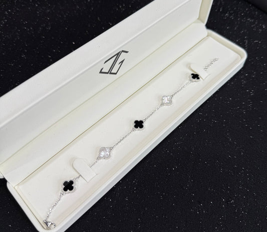 Pulso tipo VCA negro y blanco plata