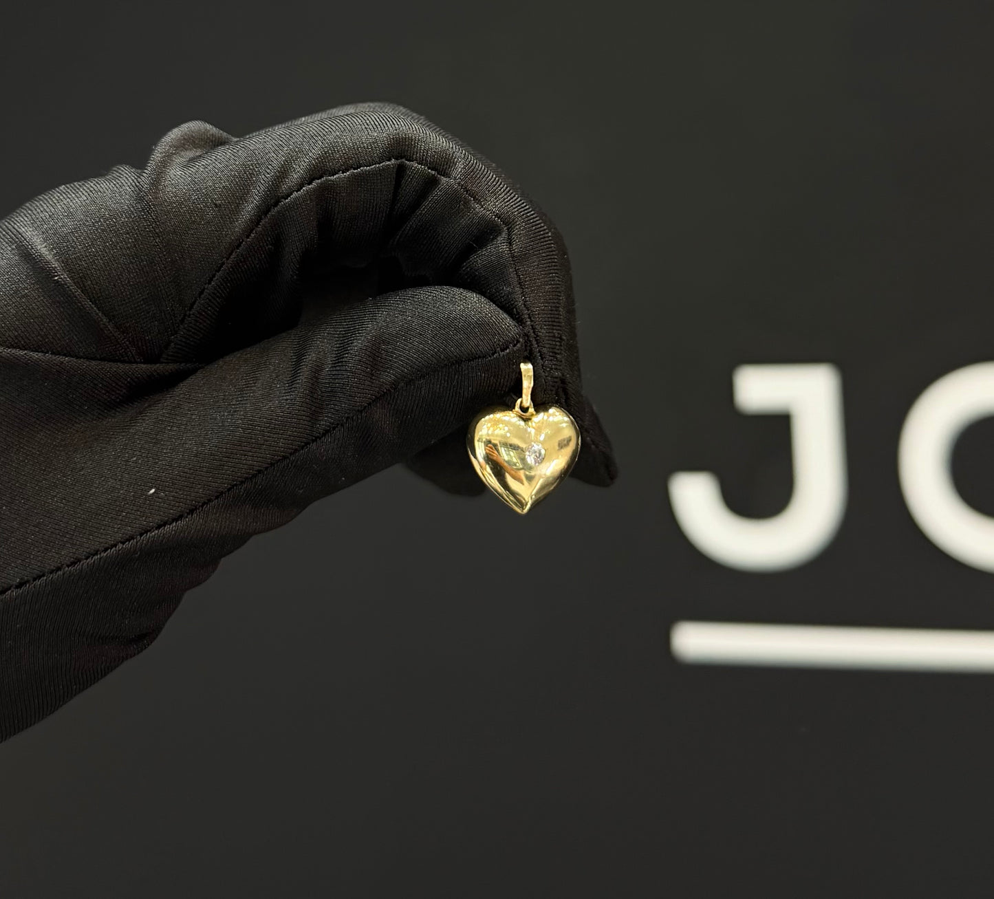 Dije corazón con piedra Oro 10k.